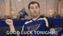 a man in a blue jersey is giving a thumbs up and says `` good luck tonight '' .