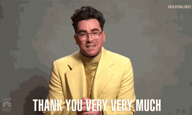 a man in a yellow suit and glasses says thank you very very much