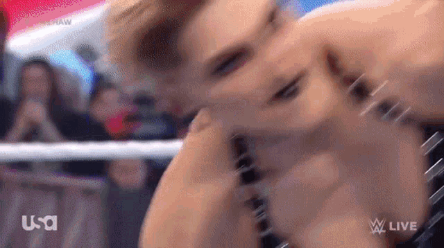 a blurry picture of a person wrestling in a ring .