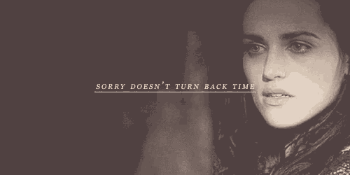 a man and a woman are looking at each other with the words " sorry does n't turn back time " below them