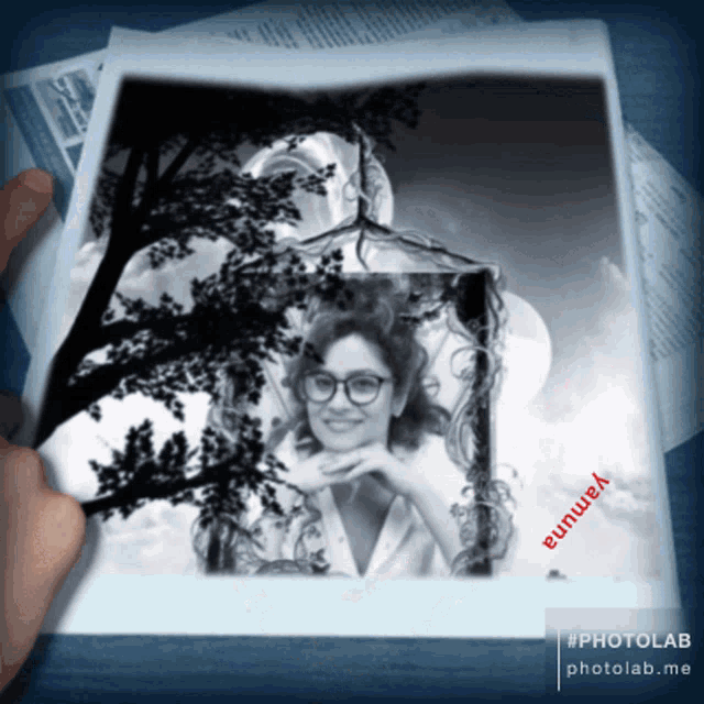 a black and white photo of a woman with yanuna written on the bottom right