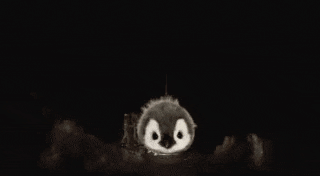 a penguin is flying through the air on a rocket .