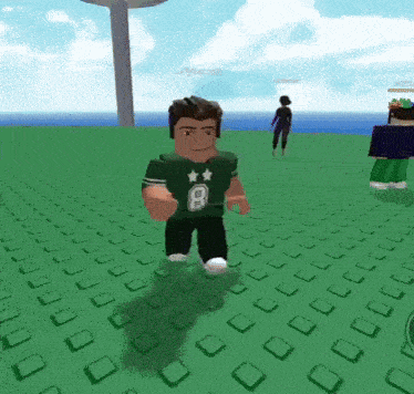 a man in a green shirt with the letter b on it