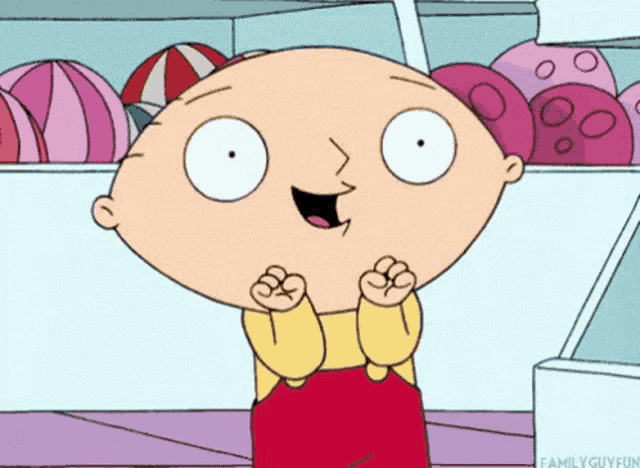 a cartoon character named stewie from family guy is standing in front of a display of beach balls