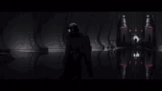 darth vader is standing in a dark room with red lights on the walls