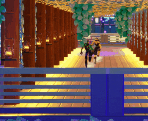 a couple of people are walking down a hallway with lanterns hanging from the ceiling