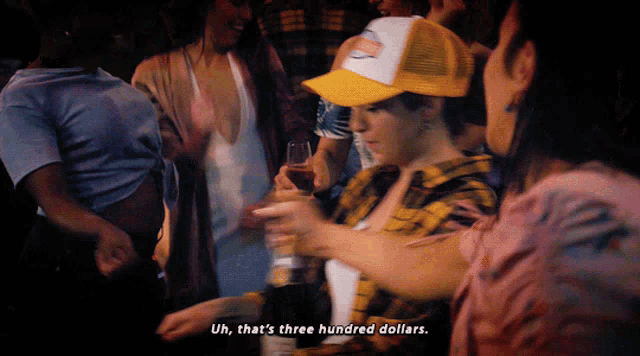a group of people are dancing and one of them says uh that 's three hundred dollars