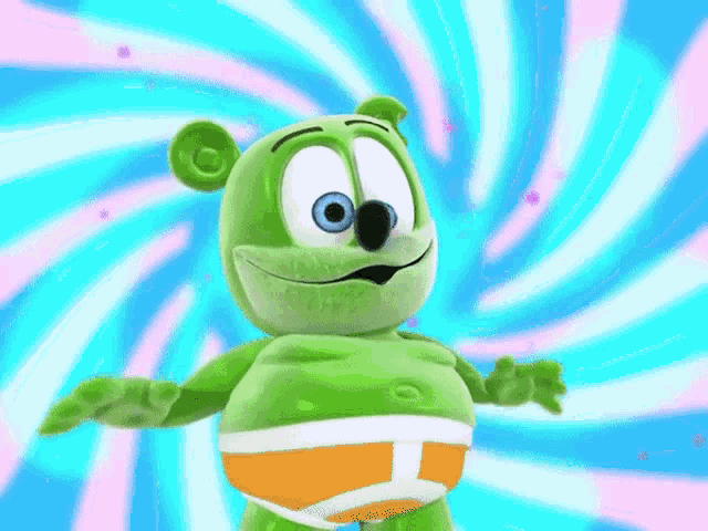 a green gummy bear wearing orange and white underwear stands in front of a spiral background