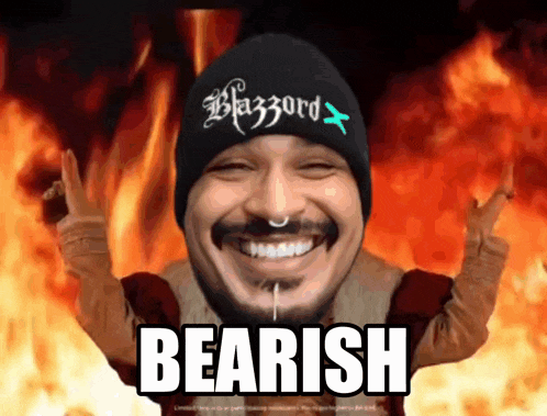 a man wearing a black beanie with the word blizzard on it is smiling
