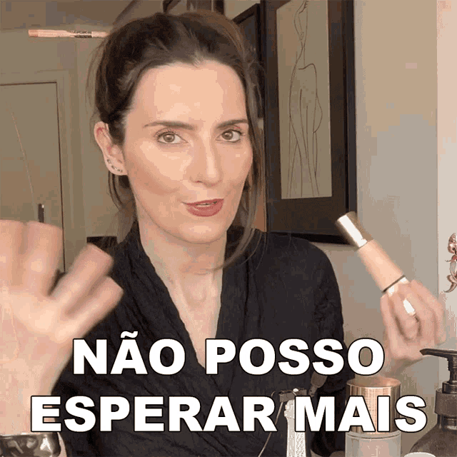 a woman is holding a makeup brush with the words não posso esperar mais below her