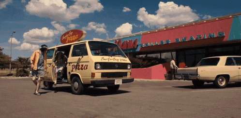 a van that says pizza on the side of it