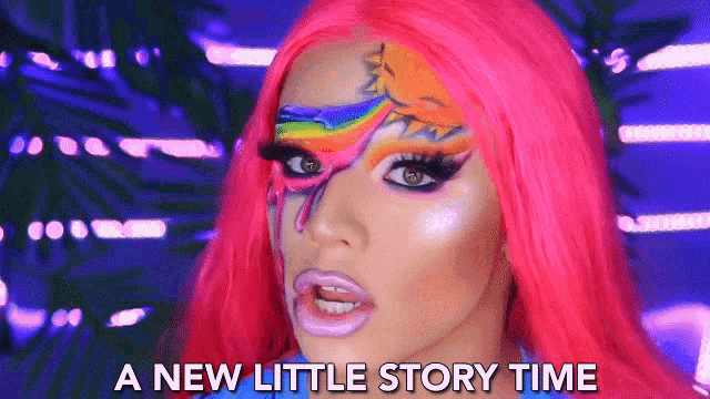 a woman with pink hair and a rainbow painted on her face is saying a new little story time .