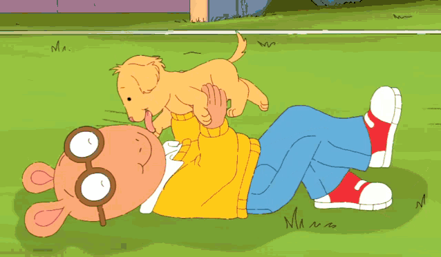 a cartoon character laying on the grass with a puppy on his back