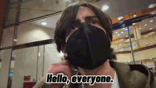 a man in a mask says hello everyone