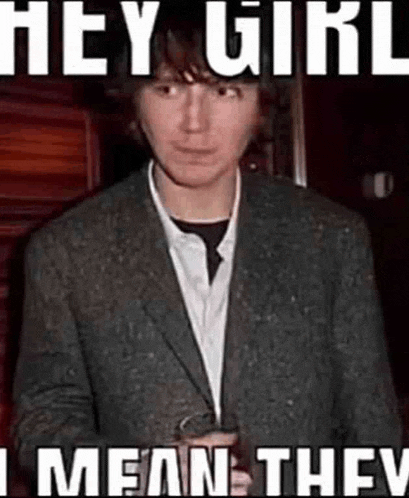 a man in a suit is holding a glass of beer and a meme says hey girl i mean they .