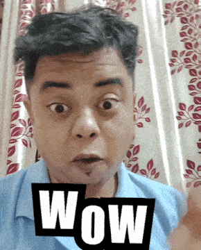 a man with a surprised look on his face is holding a wow sign in front of him