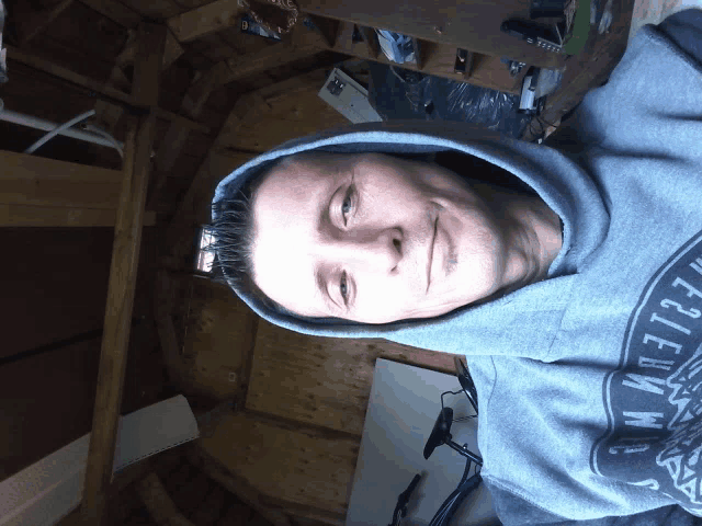 a man wearing a hoodie that says ' eagle 's ' on it