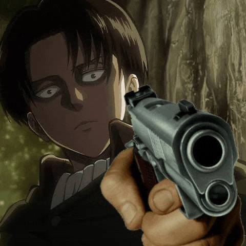 a close up of a person holding a gun in front of a man in a suit .