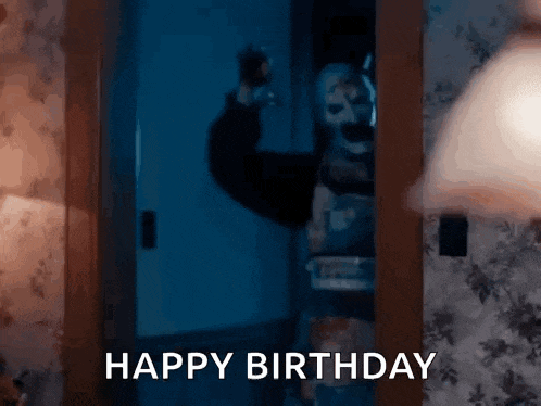 a person is standing in a doorway with a clown mask on their face .