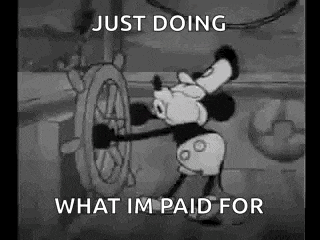 a black and white cartoon of mickey mouse steering a ship .