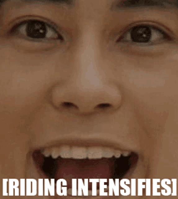 a close up of a person 's face with the words riding intensifies written below it