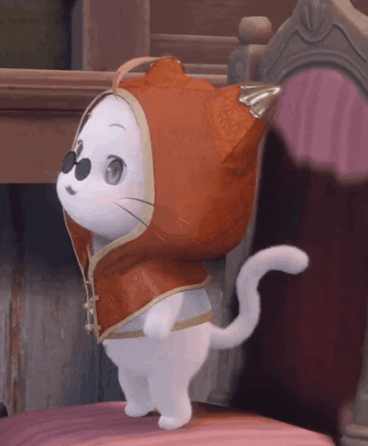 a white cat wearing a red cape and sunglasses