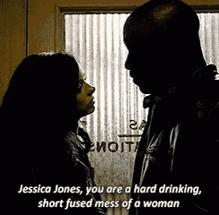 a man and a woman are standing next to each other and the woman is saying jessica jones