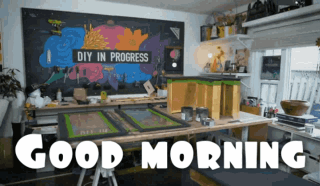 a sign that says " diy in progress " hangs above a desk