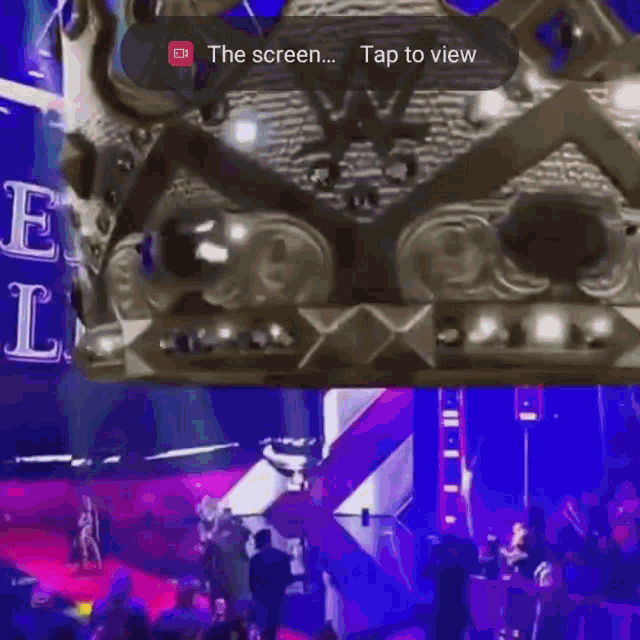 a screen shot of a concert with the words tap to view at the top