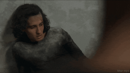 a man laying on the floor with khor-mp4 written in the corner