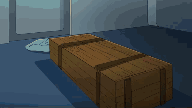 a cartoon cat is in a wooden box