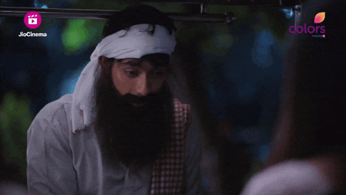 a man with a beard and a bandana on his head is on a jio cinema screen