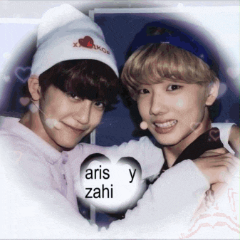 two young men are hugging each other with a heart that says aris y zahi on it