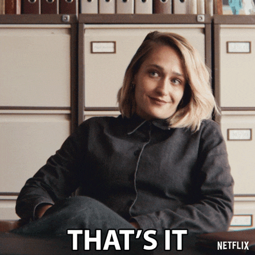 a woman is smiling and says that 's it on the screen