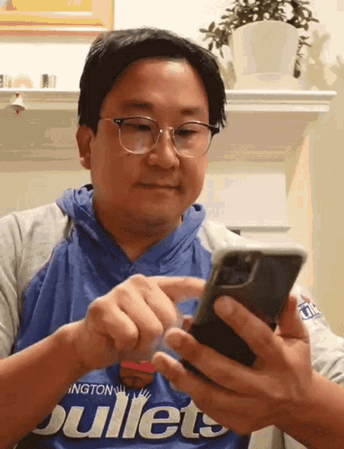 Checking Phone Nick Cho GIF