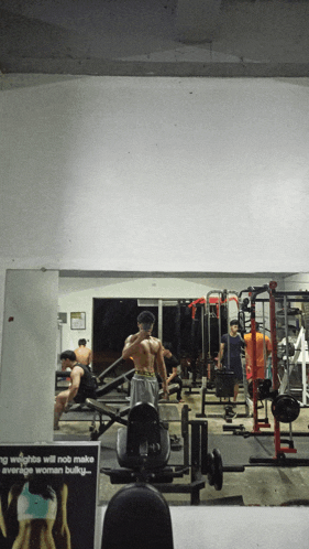 a sign in a gym says that weights will not make average woman bulky