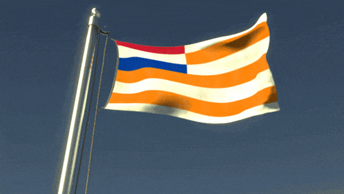 a flag with orange white and blue stripes is flying in the wind