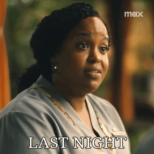 a woman says last night in front of a max sign