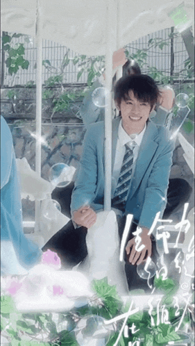 a man in a suit and tie sits on a carousel