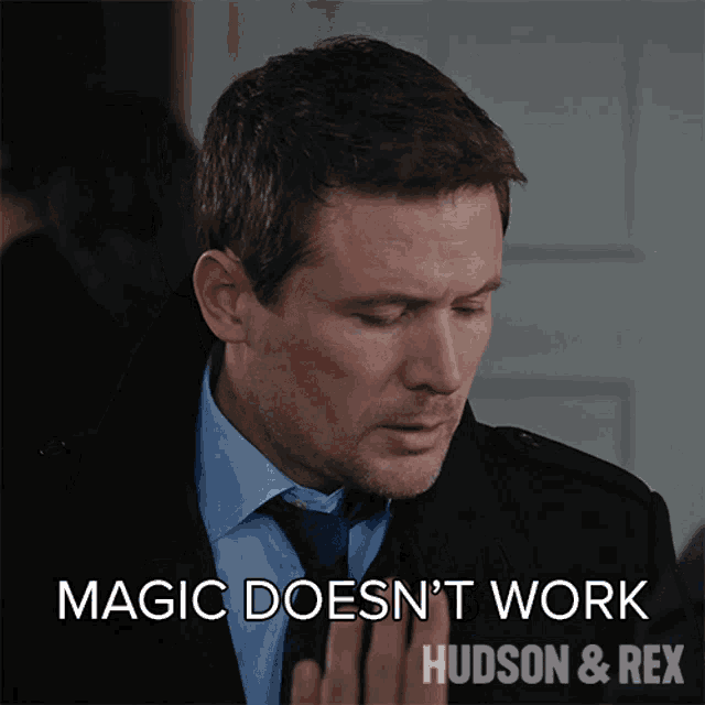 a picture of a man in a suit and tie with the caption magic does n't work