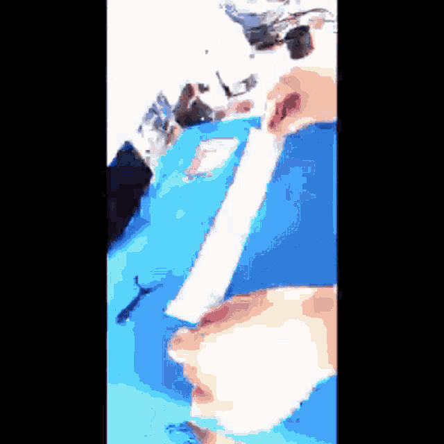 a person holding a piece of paper in their hand