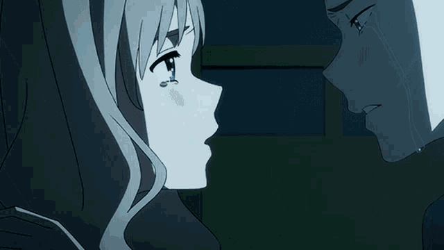 a man and a woman are kissing with tears coming down their faces