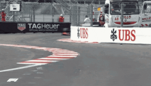 a race track with a sign that says tag heuer and ubs