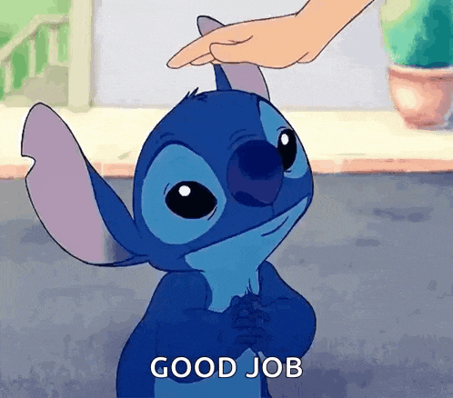 a person is petting stitch 's head with their finger .
