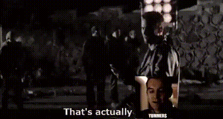 a man in a suit and tie is standing in front of a group of people and says that 's actually .
