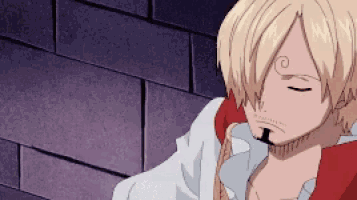 sanji from one piece is standing in front of a brick wall .