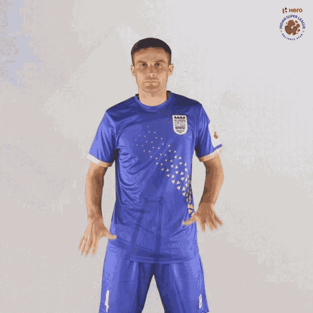 a man wearing a blue jersey that says ' mumbai city fc ' on it
