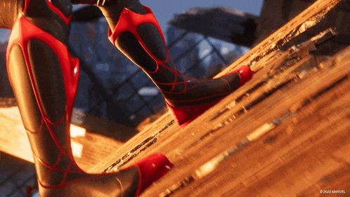 a close up of a person 's feet in a spiderman costume
