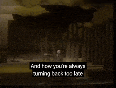 a man in a suit stands in front of trees with the words and how you 're always turning back too late below him
