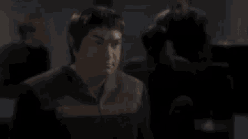 a blurred image of a man with the words ah you mean sex behind him